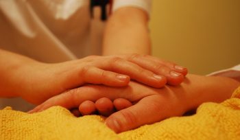 nurse-holding-hand-of-patient